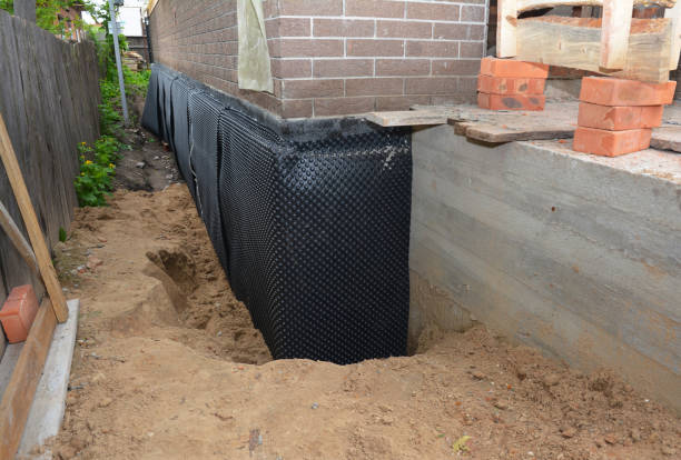 Happy homeowners after waterproofing job in Williamsburg